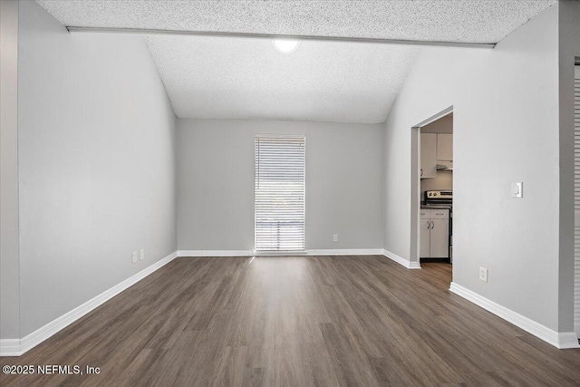 404 Villa Del Mar Dr Unit J-4, Ponte Vedra Beach, FL 32082 - unfurnished living room with dark wood-style flooring, a textured ceiling, and vaulted ceiling