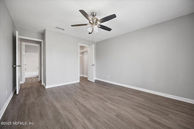 404 Villa Del Mar Dr Unit J-4, Ponte Vedra Beach, FL 32082 - unfurnished bedroom featuring dark wood finished floors, a textured ceiling, ceiling fan, and a closet