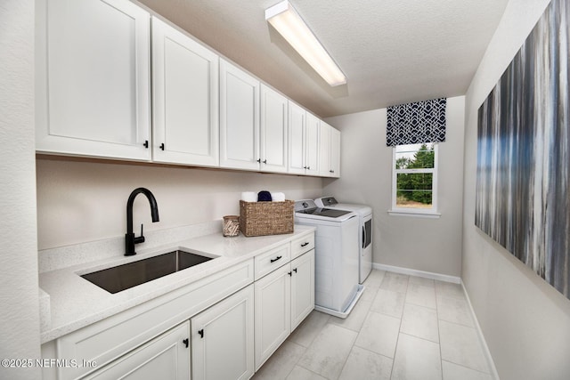 523 White Rabbit Run, Saint Augustine, FL 32092 - laundry area with washing machine and dryer, cabinet space, and a textured ceiling
