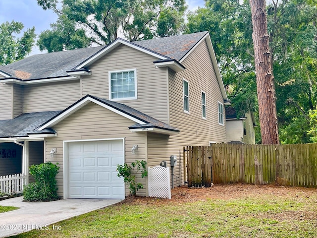 86069 Pineview Dr, Yulee, FL 32097 - traditional home with a shingled roof, concrete driveway, and a garage