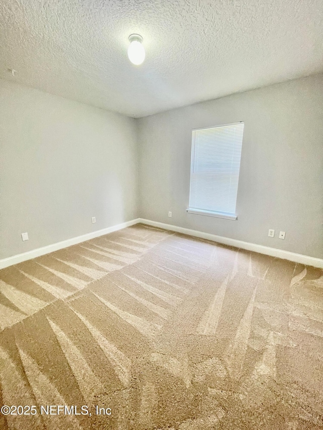 86069 Pineview Dr, Yulee, FL 32097 - spare room featuring carpet and a textured ceiling