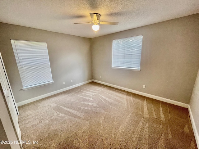 86069 Pineview Dr, Yulee, FL 32097 - empty room with carpet floors, ceiling fan, and a textured ceiling