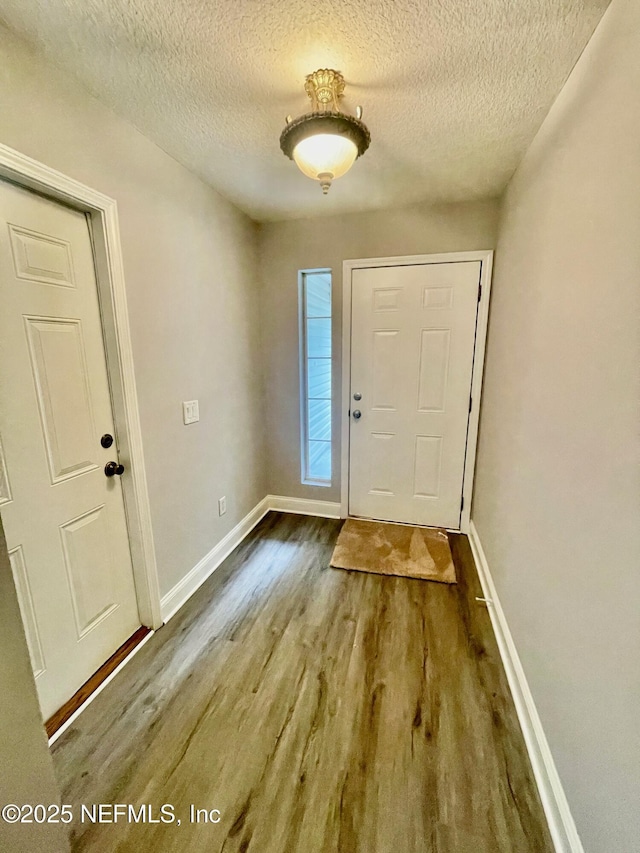 86069 Pineview Dr, Yulee, FL 32097 - foyer entrance with wood finished floors and a textured ceiling