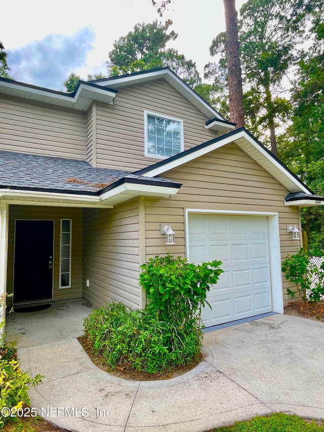 86069 Pineview Dr, Yulee, FL 32097 - view of front of home with a garage and concrete driveway