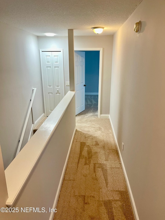 86069 Pineview Dr, Yulee, FL 32097 - corridor with an upstairs landing, light carpet, and a textured ceiling