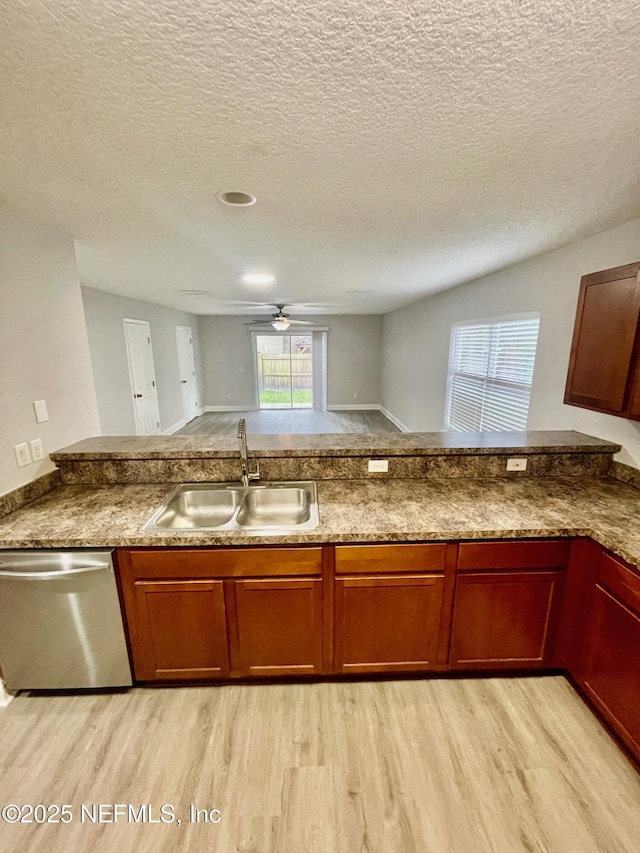 86069 Pineview Dr, Yulee, FL 32097 - kitchen featuring dishwasher, light wood finished floors, ceiling fan, a textured ceiling, and a peninsula