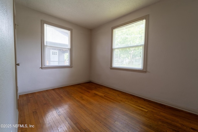 3312 Dellwood Ave, Jacksonville, FL 32205 - unfurnished room featuring wood-type flooring and a textured ceiling