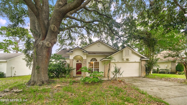2109 Hovington Cir W, Jacksonville, FL 32246 - view of front of property with brick siding, a garage, and concrete driveway
