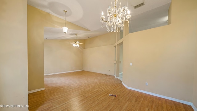 2109 Hovington Cir W, Jacksonville, FL 32246 - spare room featuring a ceiling fan, wood finished floors, a chandelier, and high vaulted ceiling