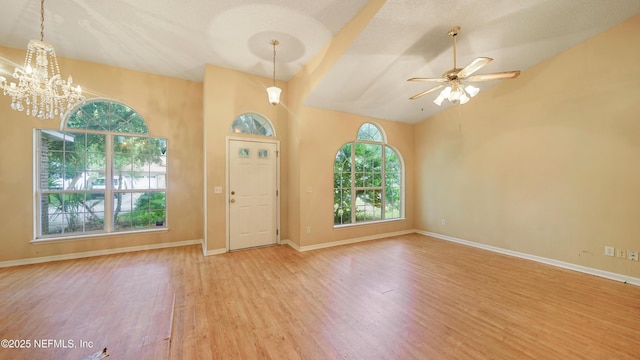 2109 Hovington Cir W, Jacksonville, FL 32246 - foyer with wood finished floors, a chandelier, a ceiling fan, and lofted ceiling