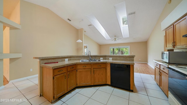 2109 Hovington Cir W, Jacksonville, FL 32246 - kitchen with dishwasher, electric range, a skylight, vaulted ceiling, and light countertops