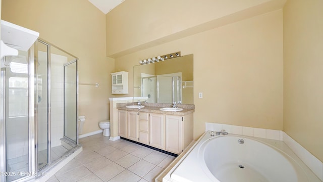 2109 Hovington Cir W, Jacksonville, FL 32246 - bathroom featuring a bath, double vanity, a shower stall, and tile patterned flooring