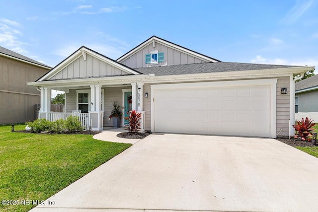 75078 Glenspring Way, Yulee, FL 32097 - view of front of house with board and batten siding, a porch, driveway, and a front yard