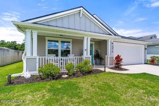 75078 Glenspring Way, Yulee, FL 32097 - view of front of house with board and batten siding, concrete driveway, covered porch, and an attached garage