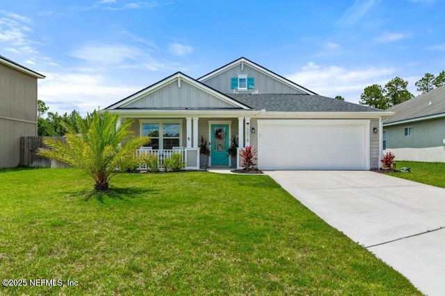 75078 Glenspring Way, Yulee, FL 32097 - view of front of home with board and batten siding, driveway, a porch, and a garage