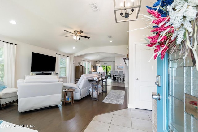 75078 Glenspring Way, Yulee, FL 32097 - living room with arched walkways, a ceiling fan, vaulted ceiling, recessed lighting, and tile patterned floors