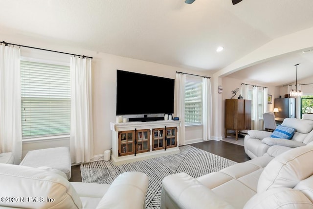 75078 Glenspring Way, Yulee, FL 32097 - living area featuring vaulted ceiling, a ceiling fan, wood finished floors, and a chandelier