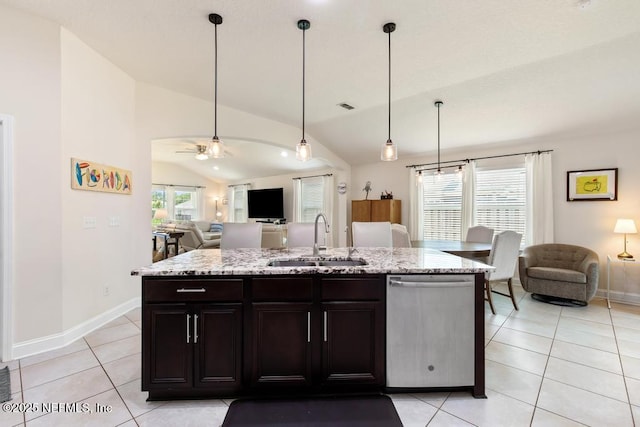 75078 Glenspring Way, Yulee, FL 32097 - kitchen with stainless steel dishwasher, open floor plan, lofted ceiling, and light tile patterned floors
