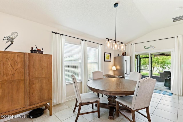 75078 Glenspring Way, Yulee, FL 32097 - dining room featuring lofted ceiling and light tile patterned flooring