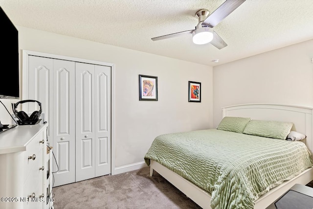 75078 Glenspring Way, Yulee, FL 32097 - bedroom with light colored carpet, a closet, ceiling fan, and a textured ceiling
