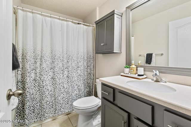 75078 Glenspring Way, Yulee, FL 32097 - bathroom with vanity, tile patterned flooring, a textured ceiling, and a shower with shower curtain