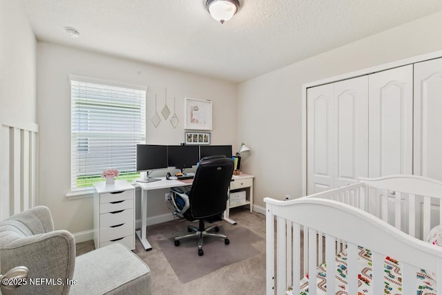 75078 Glenspring Way, Yulee, FL 32097 - bedroom with carpet flooring, a desk, a closet, and a textured ceiling