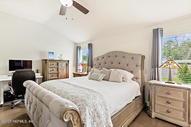 75078 Glenspring Way, Yulee, FL 32097 - bedroom with vaulted ceiling, wood finished floors, ceiling fan, and a desk
