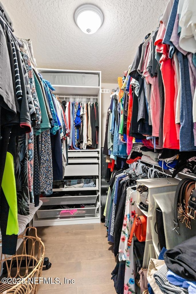 75078 Glenspring Way, Yulee, FL 32097 - spacious closet featuring wood finished floors