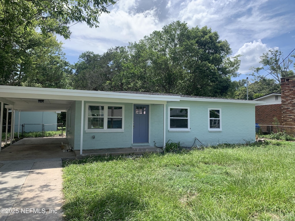 212 Spring St, Saint Augustine, FL 32084 - ranch-style home featuring driveway, a carport, and brick siding