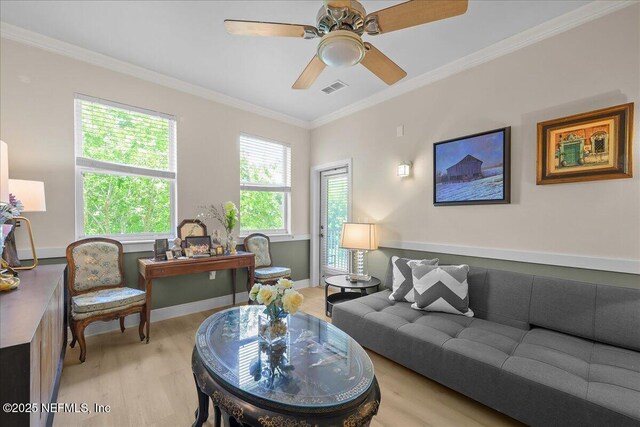 25 Riverview Bnd N Unit 122, Palm Coast, FL 32137 - living room with light wood-type flooring, ornamental molding, and a ceiling fan