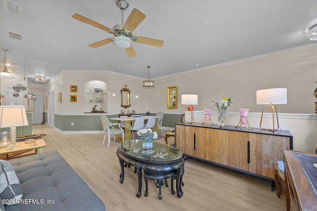25 Riverview Bnd N Unit 122, Palm Coast, FL 32137 - living area featuring light wood finished floors, a ceiling fan, crown molding, and built in features