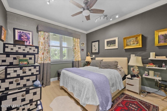 25 Riverview Bnd N Unit 122, Palm Coast, FL 32137 - bedroom with track lighting, wood finished floors, ornamental molding, and a ceiling fan