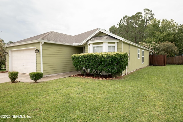 3013 Wavering Ln, Middleburg, FL 32068 - view of front of house with an attached garage, concrete driveway, and a shingled roof