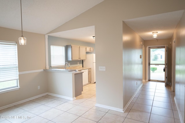 3013 Wavering Ln, Middleburg, FL 32068 - kitchen featuring white appliances, light countertops, light tile patterned flooring, a peninsula, and decorative light fixtures