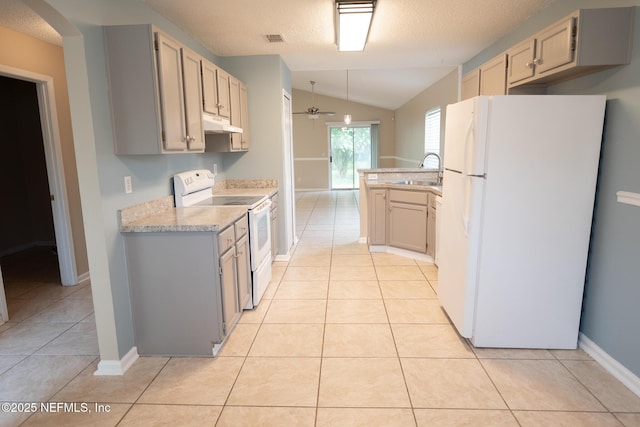 3013 Wavering Ln, Middleburg, FL 32068 - kitchen with white appliances, a ceiling fan, vaulted ceiling, light tile patterned floors, and under cabinet range hood