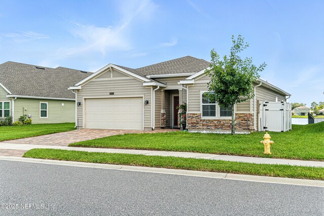 9217 Gilmore Grove Way, Jacksonville, FL 32211 - view of front of property featuring a garage, a front yard, and driveway