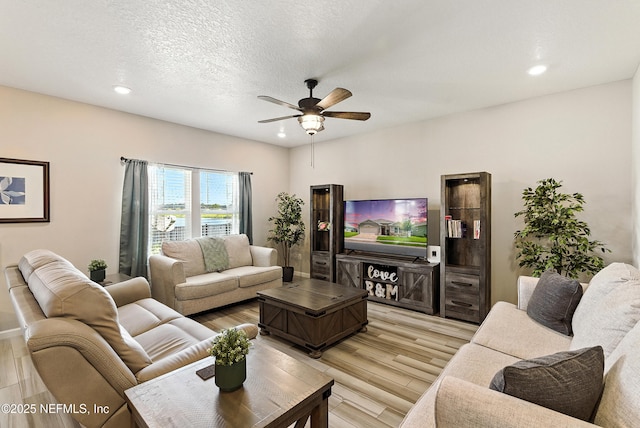 9217 Gilmore Grove Way, Jacksonville, FL 32211 - living room with light wood finished floors, a ceiling fan, and recessed lighting