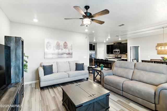 9217 Gilmore Grove Way, Jacksonville, FL 32211 - living room featuring ceiling fan, light wood-style flooring, and recessed lighting