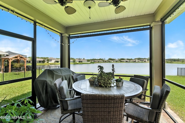 9217 Gilmore Grove Way, Jacksonville, FL 32211 - sunroom featuring a ceiling fan and a water view