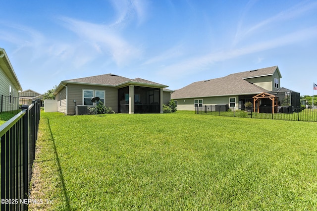 9217 Gilmore Grove Way, Jacksonville, FL 32211 - back of house with a gazebo, a fenced backyard, and a sunroom