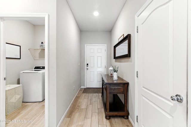 9217 Gilmore Grove Way, Jacksonville, FL 32211 - entryway with washer / clothes dryer and light wood-style flooring