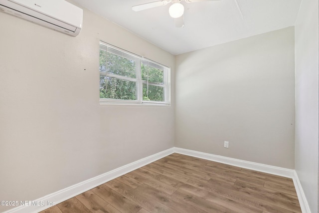 243 Ravenswood Dr, Saint Augustine, FL 32084 - unfurnished room featuring a wall mounted AC, wood finished floors, and ceiling fan