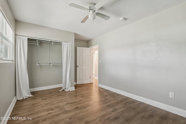 243 Ravenswood Dr, Saint Augustine, FL 32084 - unfurnished bedroom with wood finished floors, a closet, and a ceiling fan