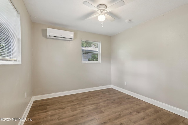 243 Ravenswood Dr, Saint Augustine, FL 32084 - empty room with a wall unit AC, wood finished floors, a ceiling fan, and a smoke detector