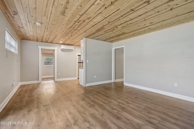 243 Ravenswood Dr, Saint Augustine, FL 32084 - spare room with wood finished floors, a wall mounted air conditioner, and wooden ceiling