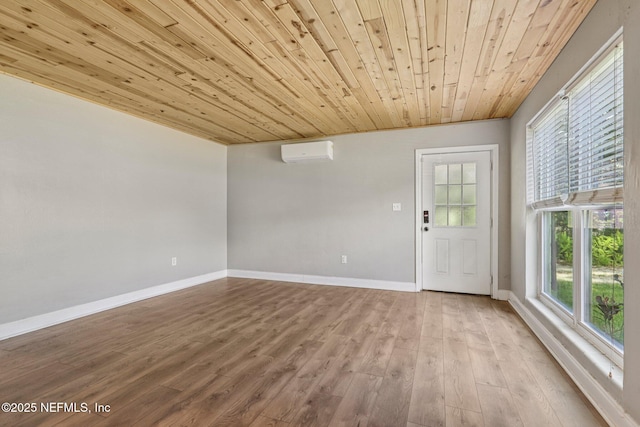 243 Ravenswood Dr, Saint Augustine, FL 32084 - empty room featuring an AC wall unit, wooden ceiling, and wood finished floors