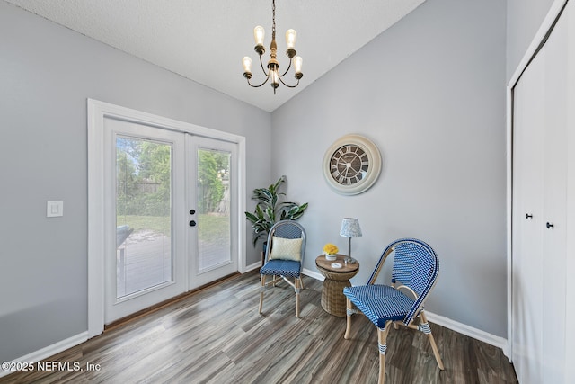 13254 Karla Cove Ln, Jacksonville, FL 32225 - living area with french doors, lofted ceiling, wood finished floors, and a chandelier