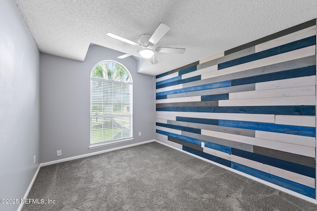 13254 Karla Cove Ln, Jacksonville, FL 32225 - unfurnished room featuring a ceiling fan, wood walls, carpet, and a textured ceiling