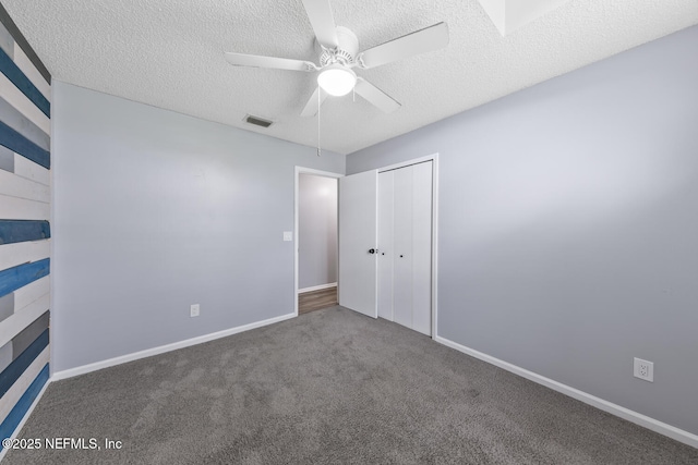 13254 Karla Cove Ln, Jacksonville, FL 32225 - unfurnished bedroom featuring a textured ceiling, carpet floors, a closet, and a ceiling fan