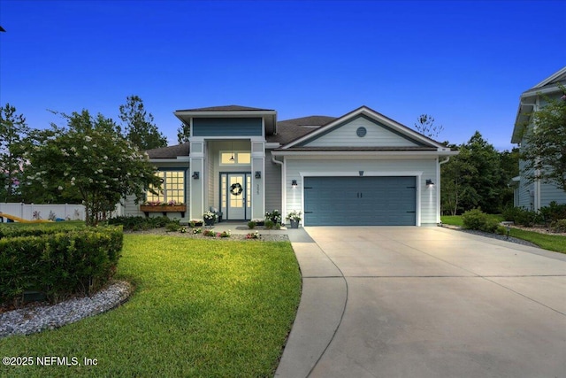 395 Jennie Lake Ct, Saint Johns, FL 32095 - view of front of house with concrete driveway, a garage, a front yard, and a shingled roof